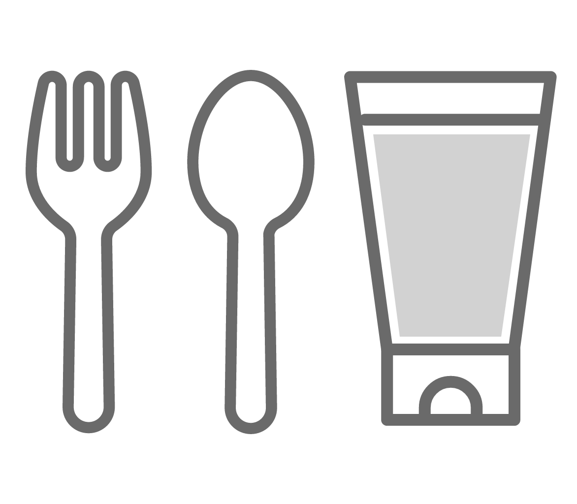 Fork, spoon, and gray tube of toothpaste or condiment displayed in a row.